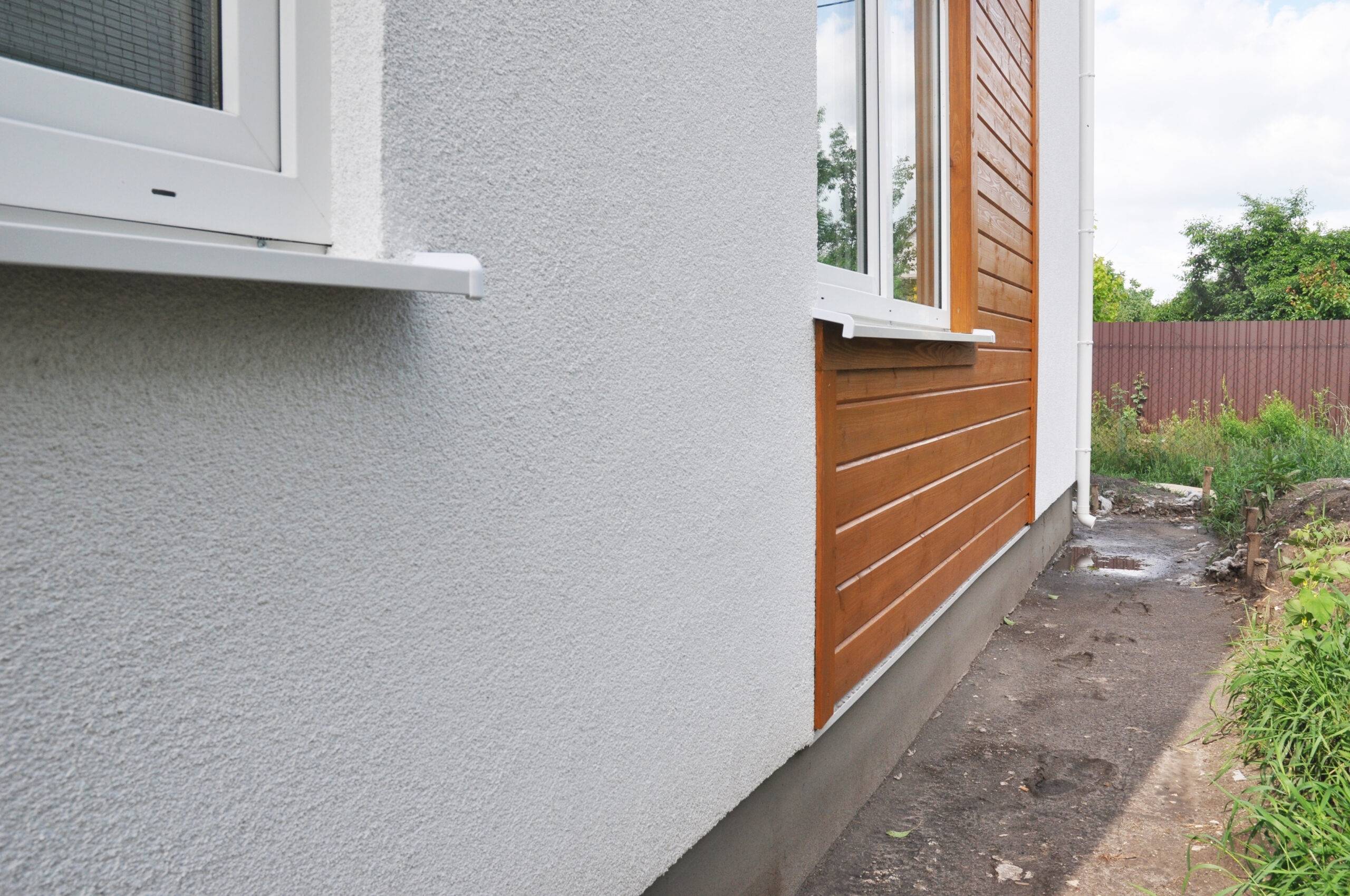 Modern house facade insulation under plastering, stucco and wood